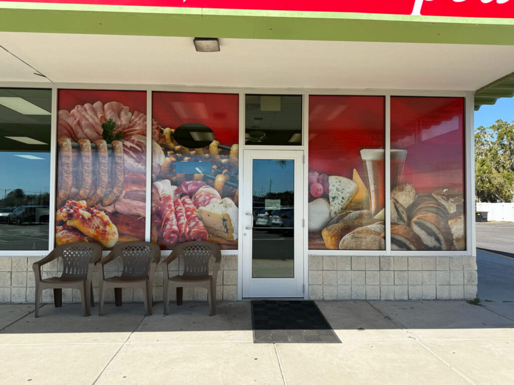 Photo of a store with prints on window